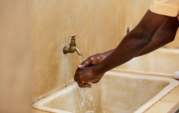 Child-washing-hands-outside-school-in-Kumasi